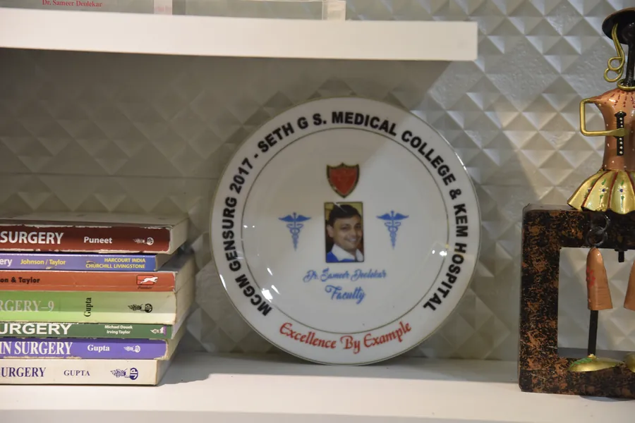 Faculty plate from Seth GS Medical College and KEM Hospital beside surgery textbooks
